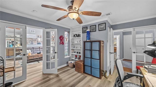 home office with ceiling fan, french doors, crown molding, and light hardwood / wood-style flooring