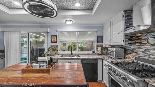 kitchen featuring dishwasher, sink, ornamental molding, wall chimney exhaust hood, and gas range