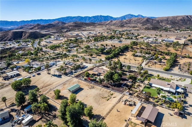 birds eye view of property with a mountain view