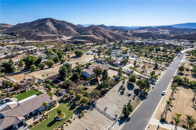 birds eye view of property with a mountain view