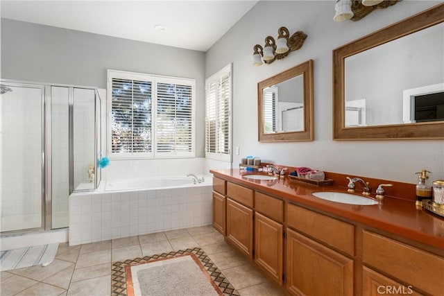 bathroom with tile patterned floors, separate shower and tub, and vanity