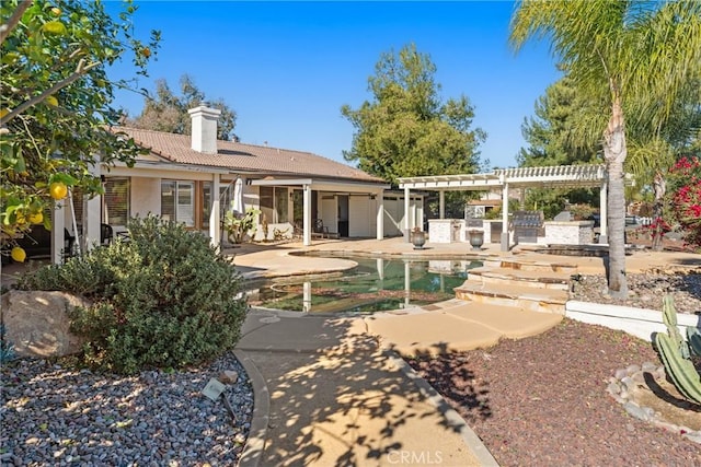 rear view of property featuring a patio area and a pergola