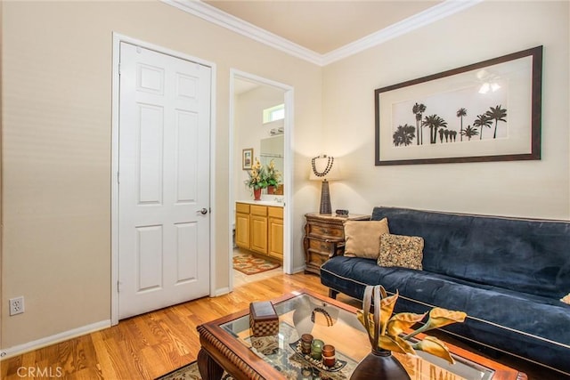 living room with light wood-type flooring and ornamental molding