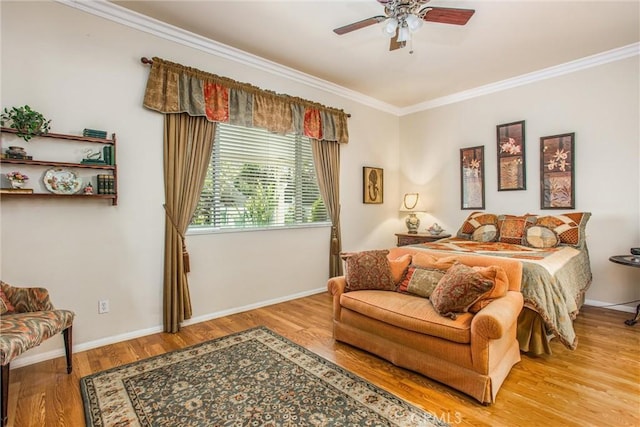 bedroom featuring ceiling fan, light hardwood / wood-style floors, and ornamental molding