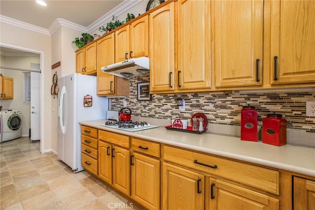 kitchen featuring separate washer and dryer, decorative backsplash, crown molding, and white appliances