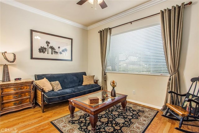 living room with ceiling fan, wood-type flooring, and ornamental molding