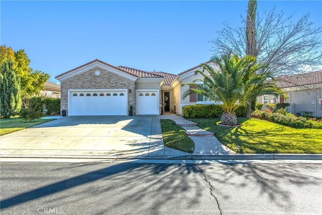 single story home with a garage and a front lawn