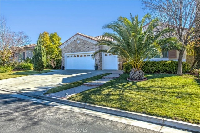 view of front of home with a front yard and a garage