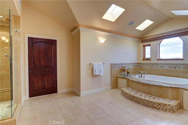 bathroom featuring plus walk in shower, tile patterned floors, and lofted ceiling with skylight