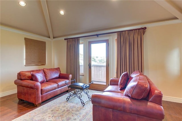 living room with ornamental molding, lofted ceiling, and dark hardwood / wood-style floors