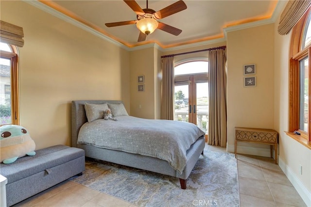 tiled bedroom featuring ceiling fan, crown molding, and french doors