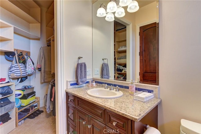 bathroom featuring toilet and vanity