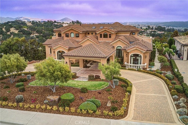 mediterranean / spanish-style home with a mountain view