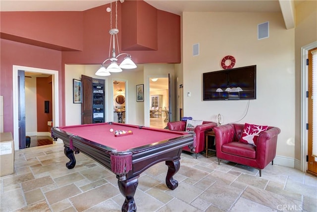 recreation room with high vaulted ceiling and billiards