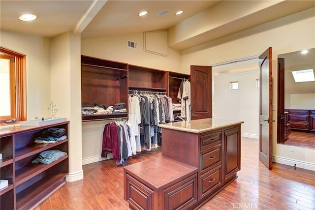 spacious closet with light wood-type flooring