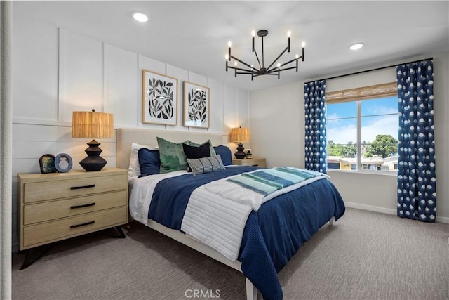 carpeted bedroom with an inviting chandelier