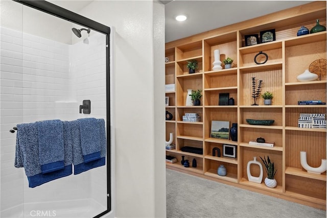 interior space featuring a shower with door