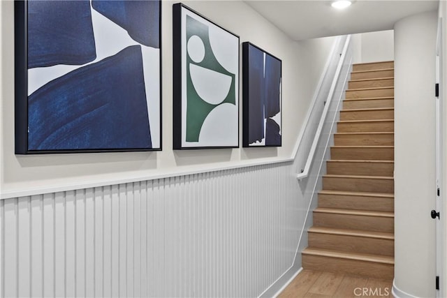 stairway featuring hardwood / wood-style flooring