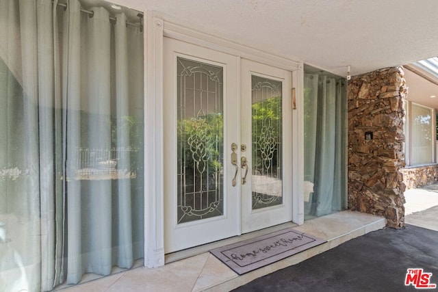 doorway to property with french doors