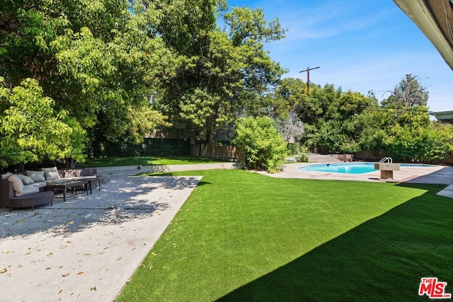 view of yard with an outdoor hangout area, a fenced in pool, and a patio area