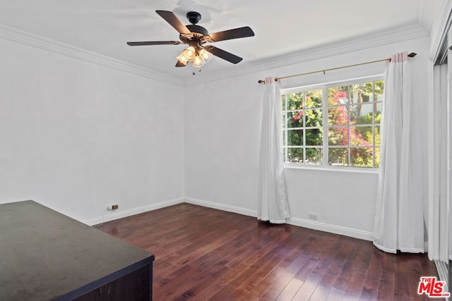 unfurnished room with ceiling fan, dark hardwood / wood-style floors, and crown molding