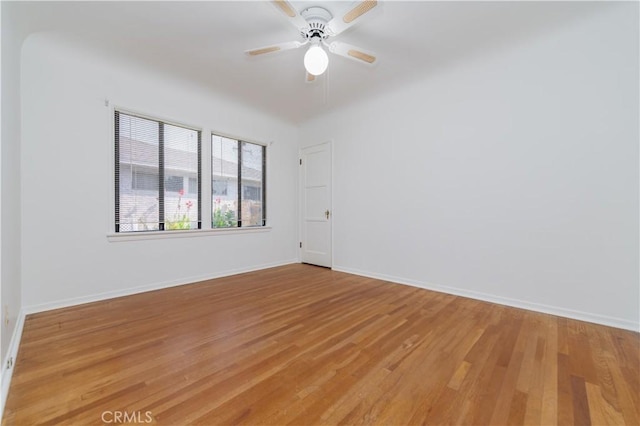 spare room with ceiling fan and light hardwood / wood-style flooring