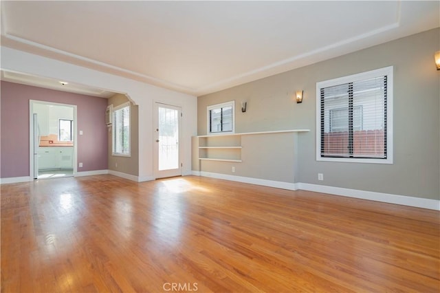 empty room with light hardwood / wood-style flooring