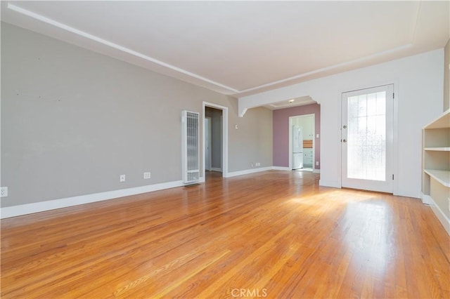 unfurnished living room featuring light hardwood / wood-style flooring