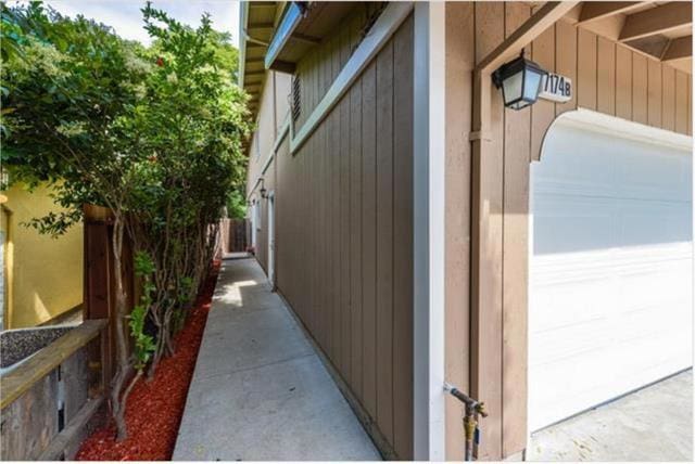 view of property exterior with a garage