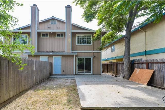 back of house with a patio area