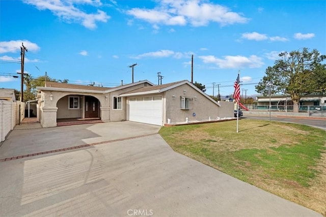 view of front of home featuring a garage and a front lawn