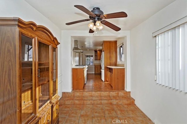 corridor featuring light tile patterned floors