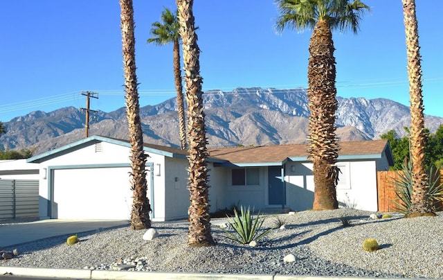 view of front of house featuring a mountain view and a garage