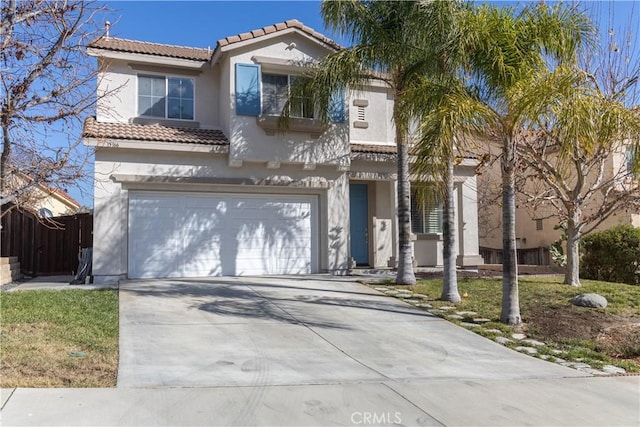 mediterranean / spanish house with a garage