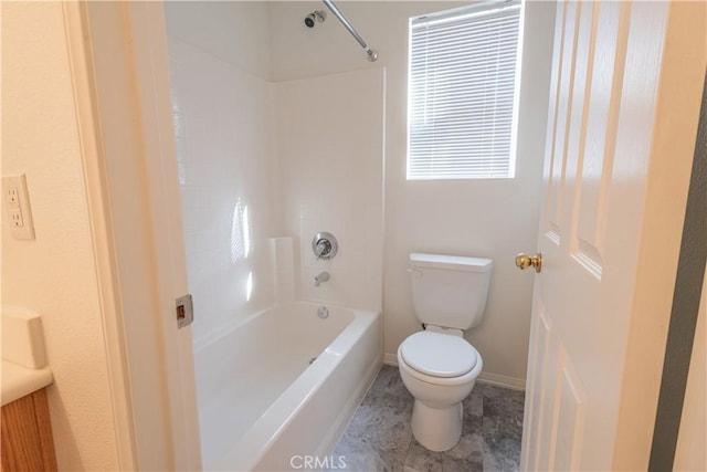 bathroom with toilet and shower / bath combination