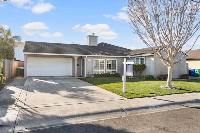 ranch-style house with a garage and a front yard