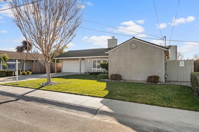 view of front of property featuring a garage and a front yard