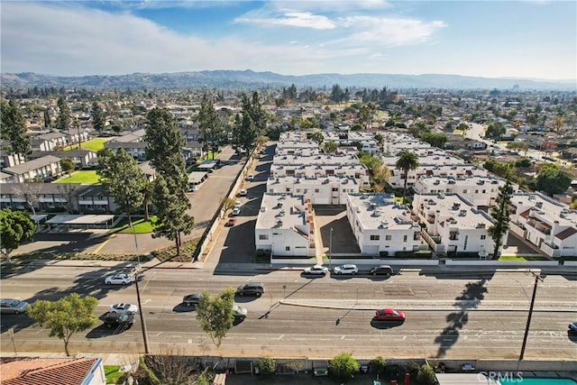 drone / aerial view featuring a mountain view