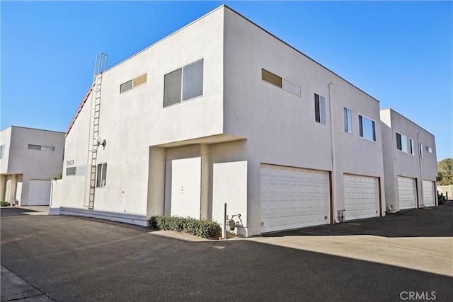 view of building exterior featuring a garage