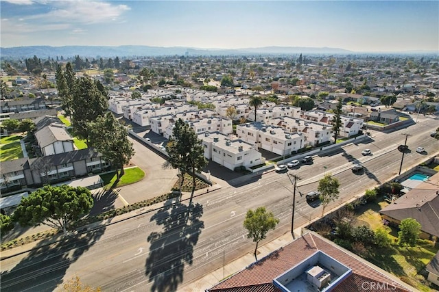 birds eye view of property featuring a mountain view