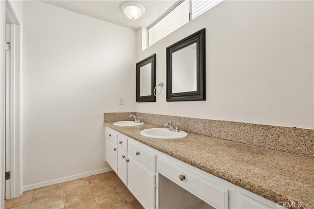 bathroom with tile patterned floors and vanity