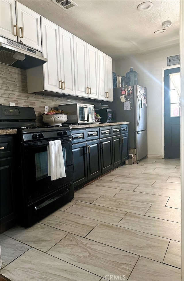 kitchen with tasteful backsplash, stainless steel appliances, and white cabinetry