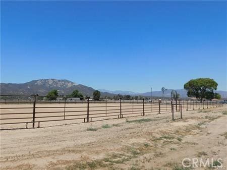 view of yard featuring a mountain view and a rural view