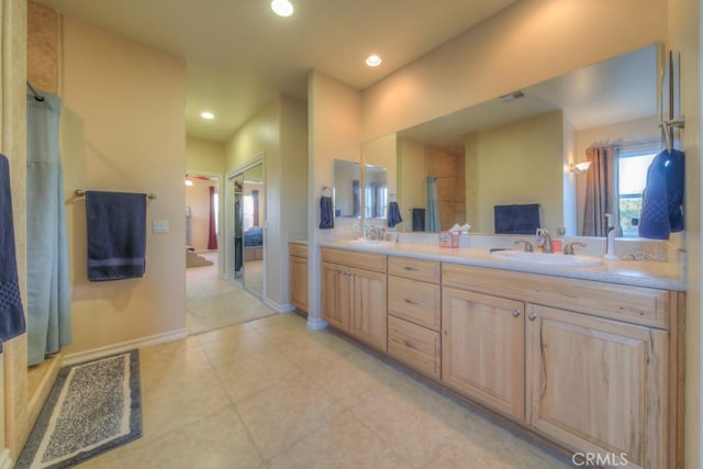 bathroom featuring vanity and tile patterned flooring