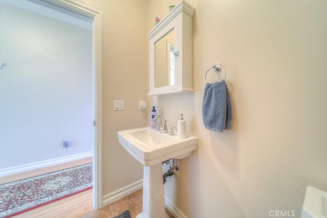 bathroom with tile patterned floors