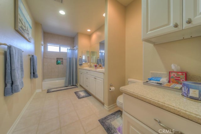 bathroom featuring toilet, vanity, tile patterned floors, and a shower with shower curtain