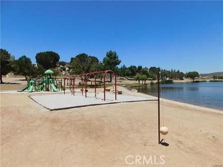 view of jungle gym with a water view