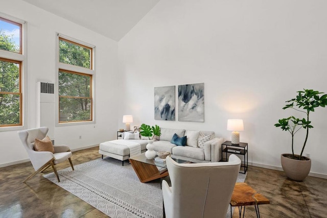 living room with high vaulted ceiling