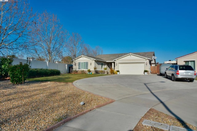 single story home with a front lawn and a garage