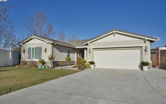 ranch-style home with a front yard and a garage